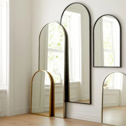 Metal framed arch Kendra golden mirror. 
