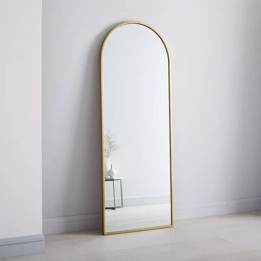 Gold metal framed arch mirror. 