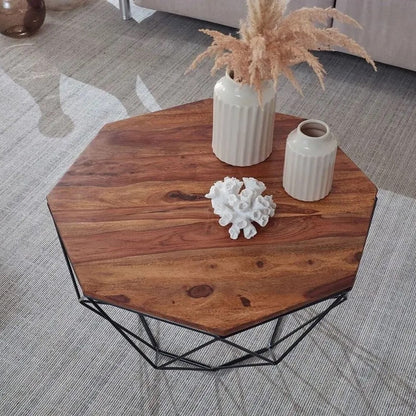 Hexagonal wooden Kerry coffee table with geometric black metal base.