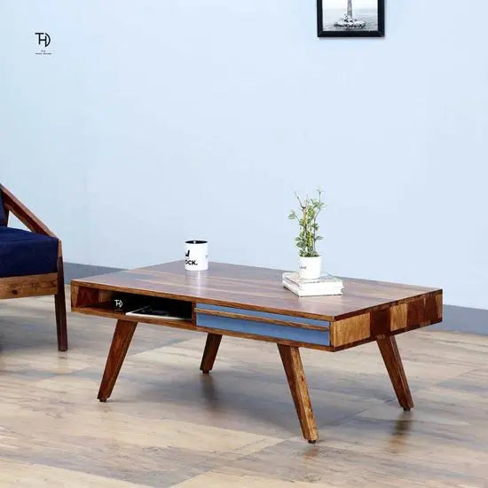 Solid wood Rectangle shape Modern Laatto coffee table with two gray-colored drawers and shelves.