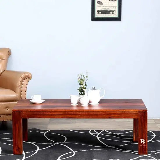 Solid wood rectangular reddish Latin coffee table. 