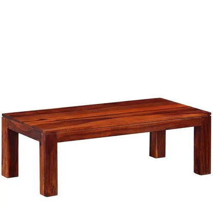 Solid sheesham wood rectangular reddish Latin coffee table.