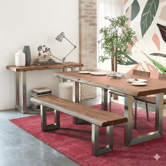 A rustic charm dining set with a live-edge table and bench made of acacia wood with silver metal legs, accompanied by two chairs with metal legs. 