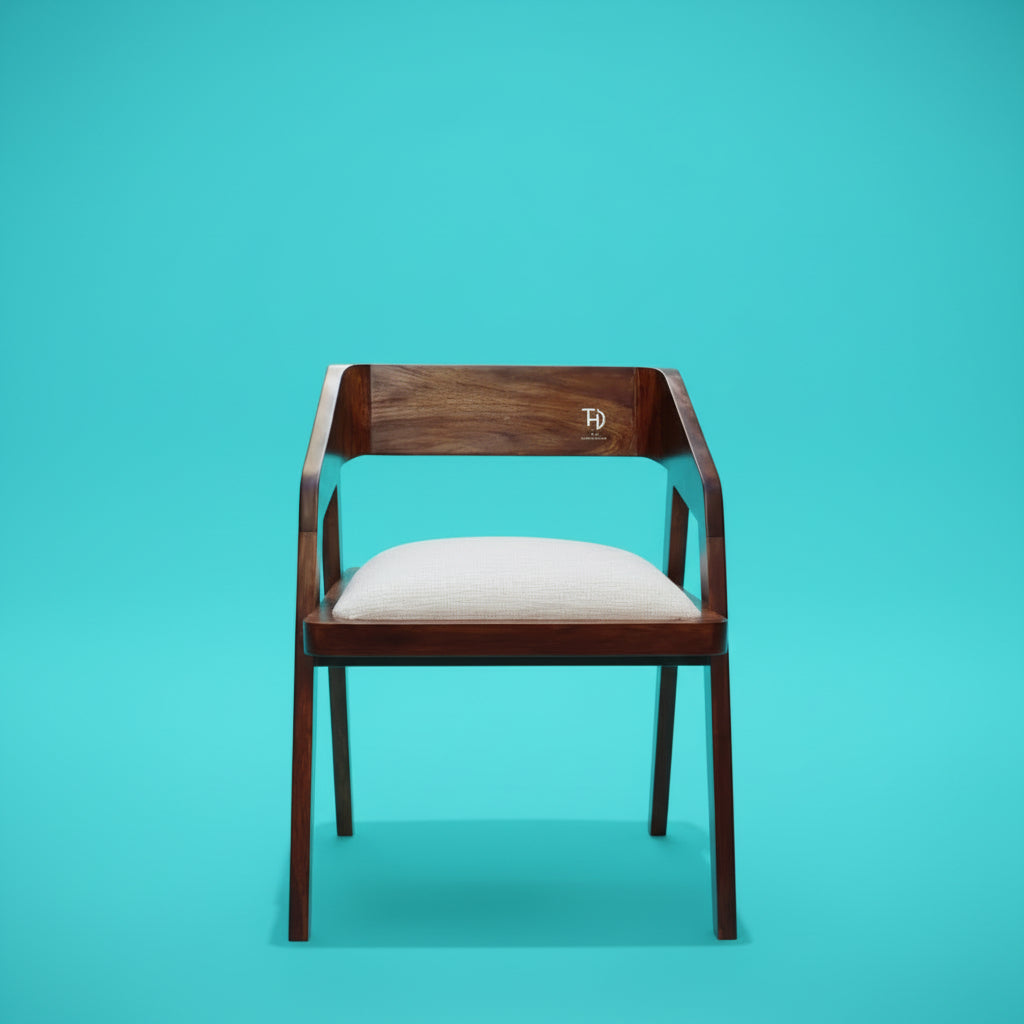 A brown Loria chair with an upholstered seat, made from solid Sheesham wood.