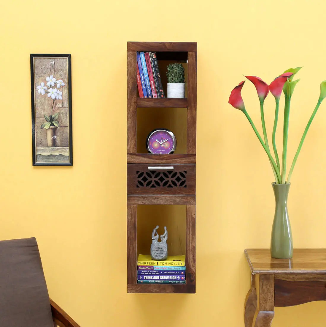 Wooden wall shelf for keeps books and decorative items.
