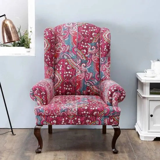 Solid wood maharaja wing chair in walnut finish with Katha fabric. 