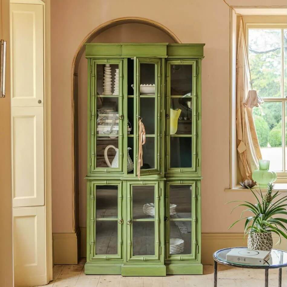 Green glass-fronted cabinet made in solid mango wood. 