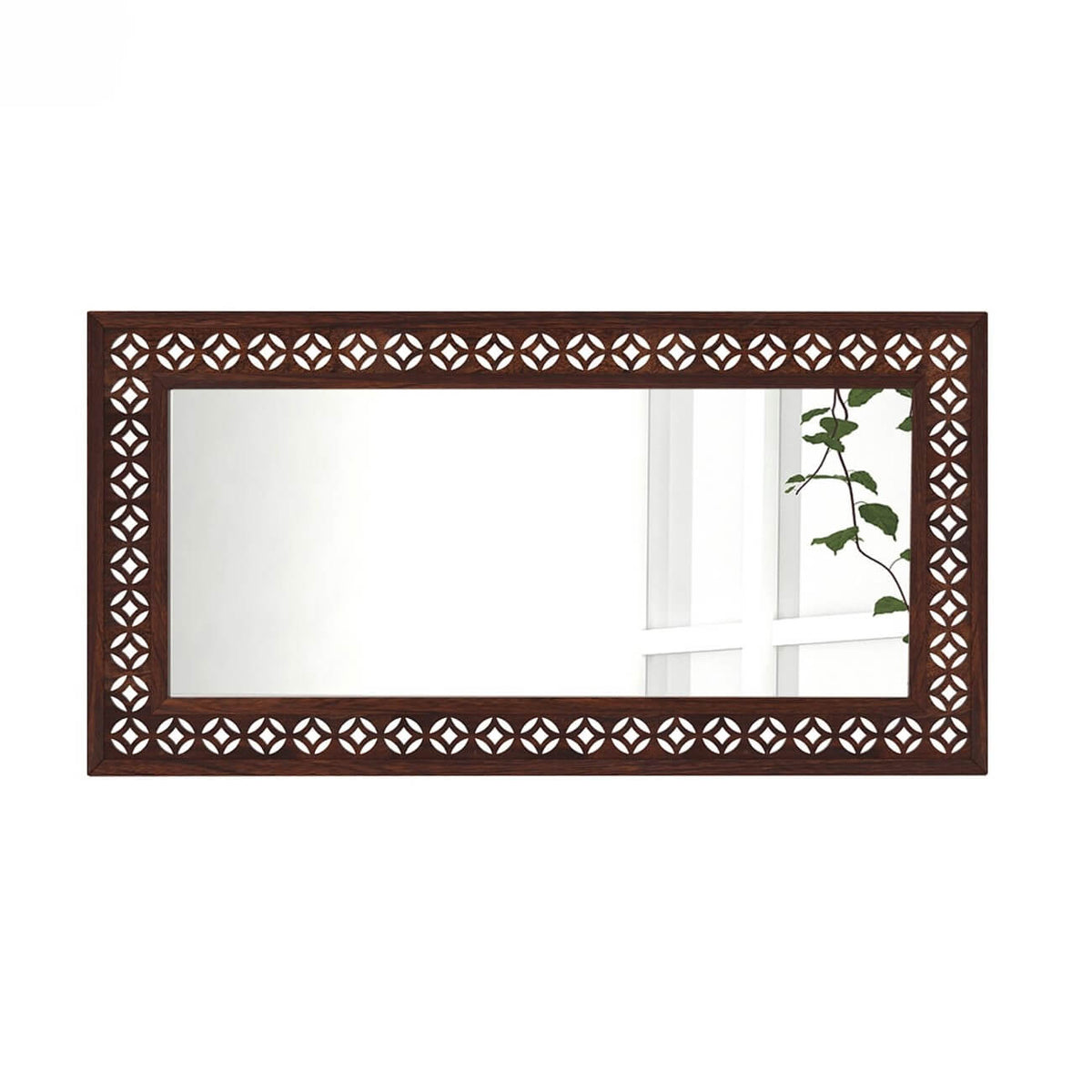 A rectangular wall mirror with an ornate dark brown wooden frame featuring a repeating geometric cutout pattern.