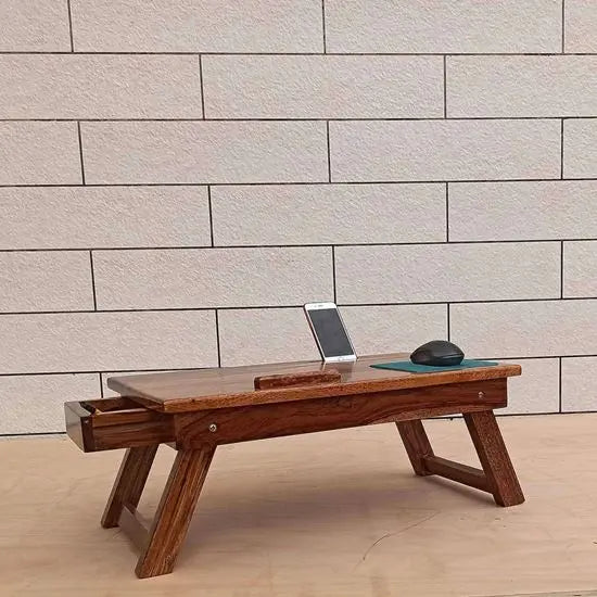 One Drawer Noah Laptop Table Made in Solid Sheesham Wood and Mousepad part is Mdf and Fabric. 