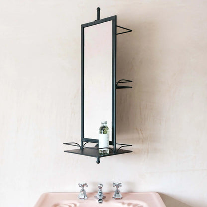 Bathroom mirror with black frame and shelf.