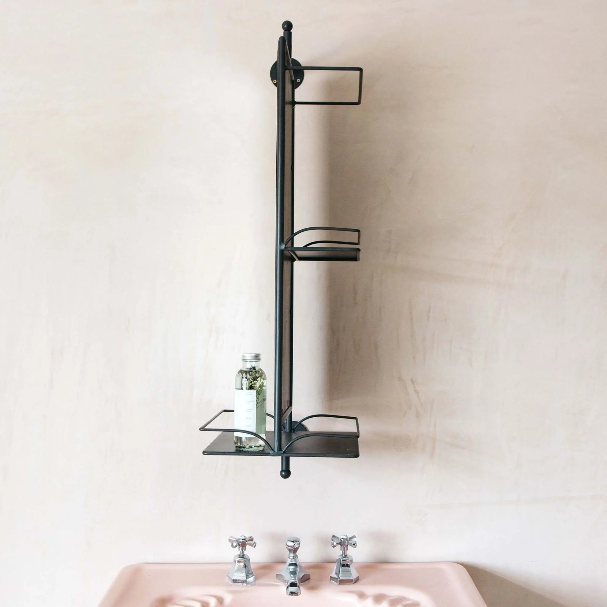 Wall-mounted black metal shelf Nyhamn Mirror.