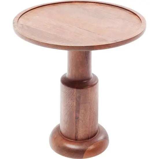 A round, natural wood colored side table made of mango wood with a turned leg design.