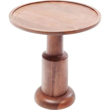 A round, natural wood colored side table made of mango wood with a turned leg design.