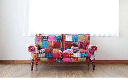 Colourful patchwork two seater sofa.
