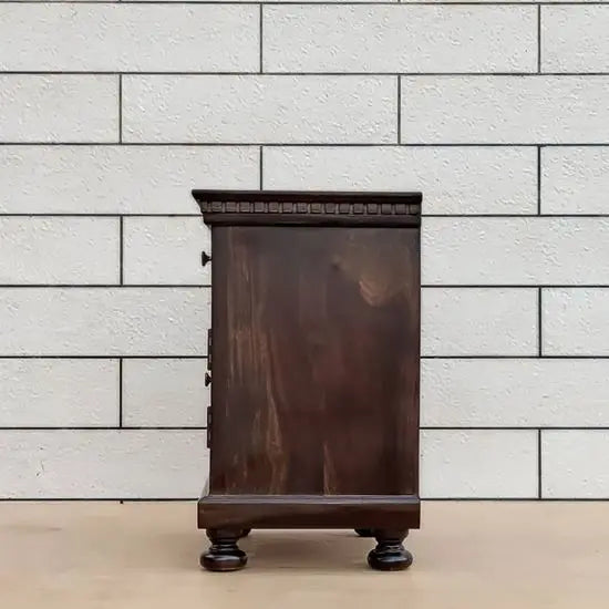 Sheesham wood One door and one drawer Planetarium bedside table with turned-round legs and gold-colored hardware.
