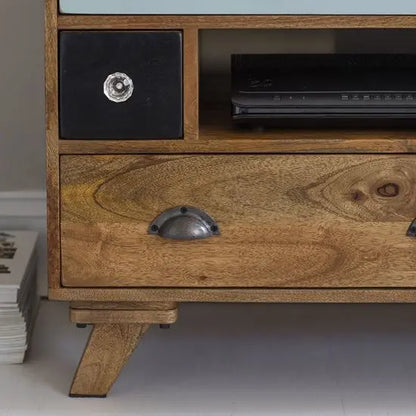 A detail shot of a multicolor TV cabinet made of solid mango wood.