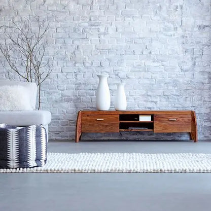 A solid sheesham wood Rhino TV cabinet with two wooden doors and open shelves, The cabinet is brown in color, with natural wood grain visible.