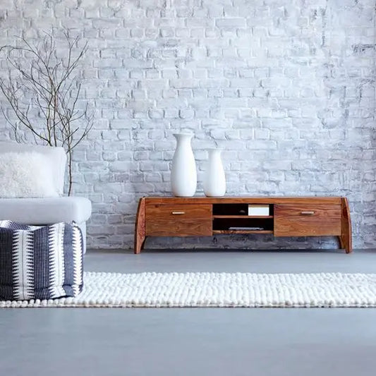 A solid sheesham wood Rhino TV cabinet with two wooden doors and open shelves, The cabinet is brown in color, with natural wood grain visible.