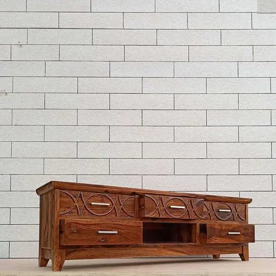Top three drawer carved fish on panel of rope tv cabinet. 