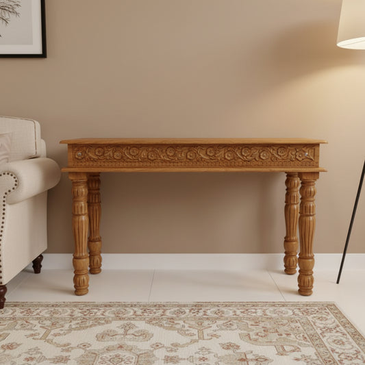 A rustic natural console table with turned legs made of mango wood with a natural top.