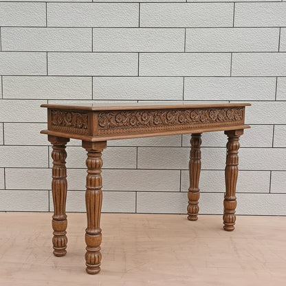 Side and legs carving console table made in solid mango wood in natural finish. 