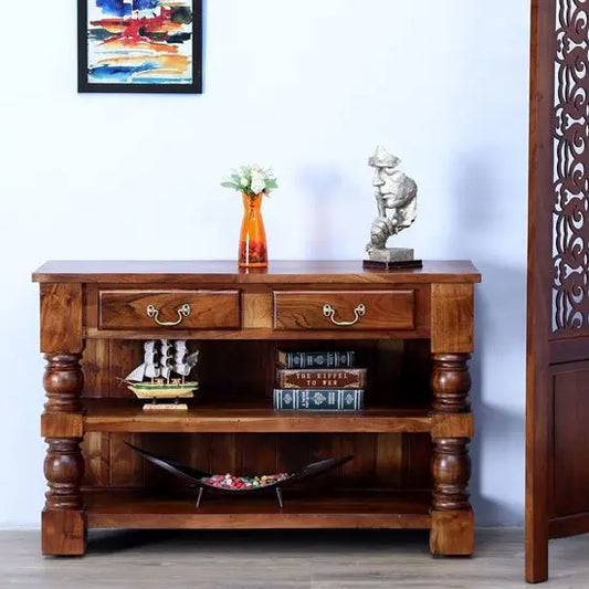 A wooden console table with lathe legs and a walnut finish, featuring two drawers and two open shelves.