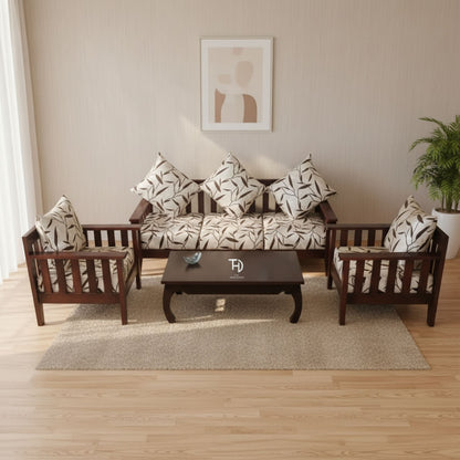 A three-seater sofa and two single-seater chairs made of Sheesham wood, upholstered with a patterned fabric, along with a wooden coffee table. Cushions are included, enhancing the aesthetic appeal of the set.