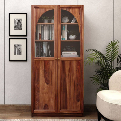A tall solid wood bookcase with two glass-front upper doors and solid lower doors.
