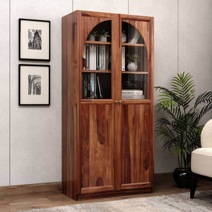 A tall wooden bookcase with two glass-front upper doors and solid lower doors.