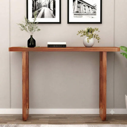 A modern wooden console table with a warm medium-brown finish, featuring oval cutout legs.