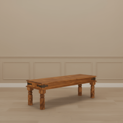 A vintage dining bench with a small rectangular tabletop and carved wooden legs. Three seater dining bench.