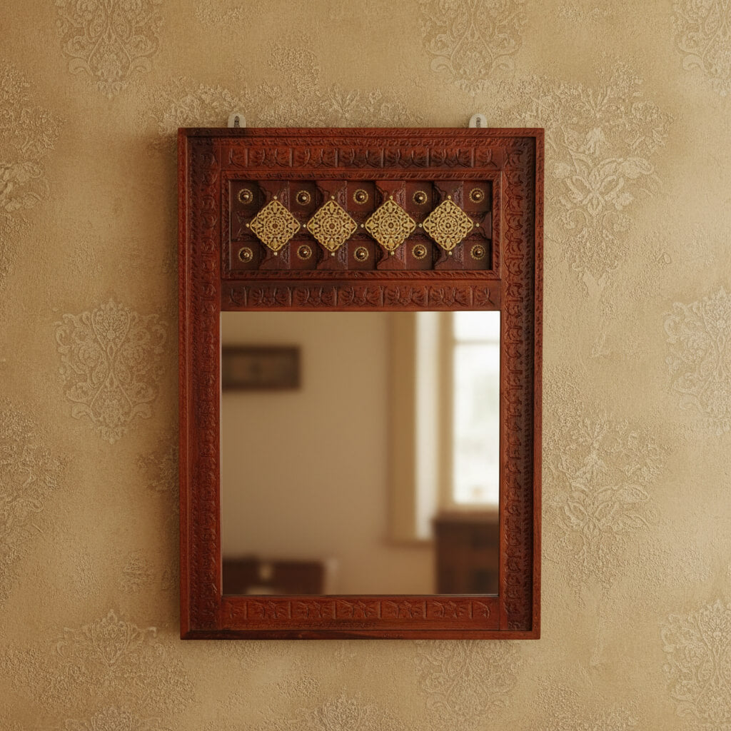 A vintage mirror frame with a brown honey-like finish and decorative elements in a geometric pattern.