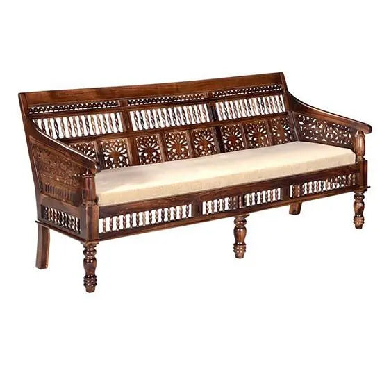 A three-seater vintage sofa made in Solid sheesham wood in natural finish with cream velvet fabric. 