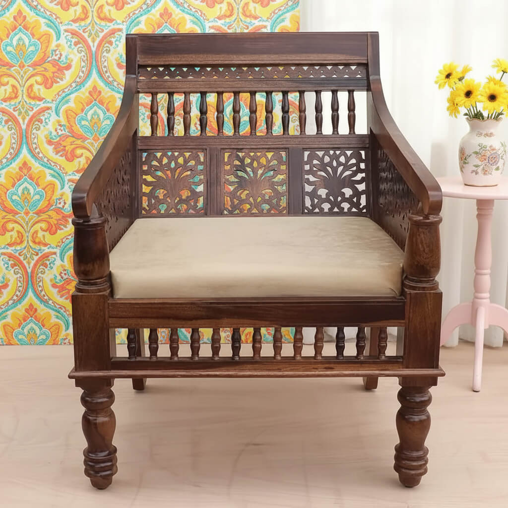 A vintage style sofa chair with natural stain finish on Sheesham wood.