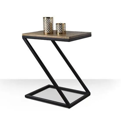 A black end table with a mango wood top and a z-shaped metal base, with dimensions 50 cms in length, 40 cms in depth, and 60 cms in height. 
